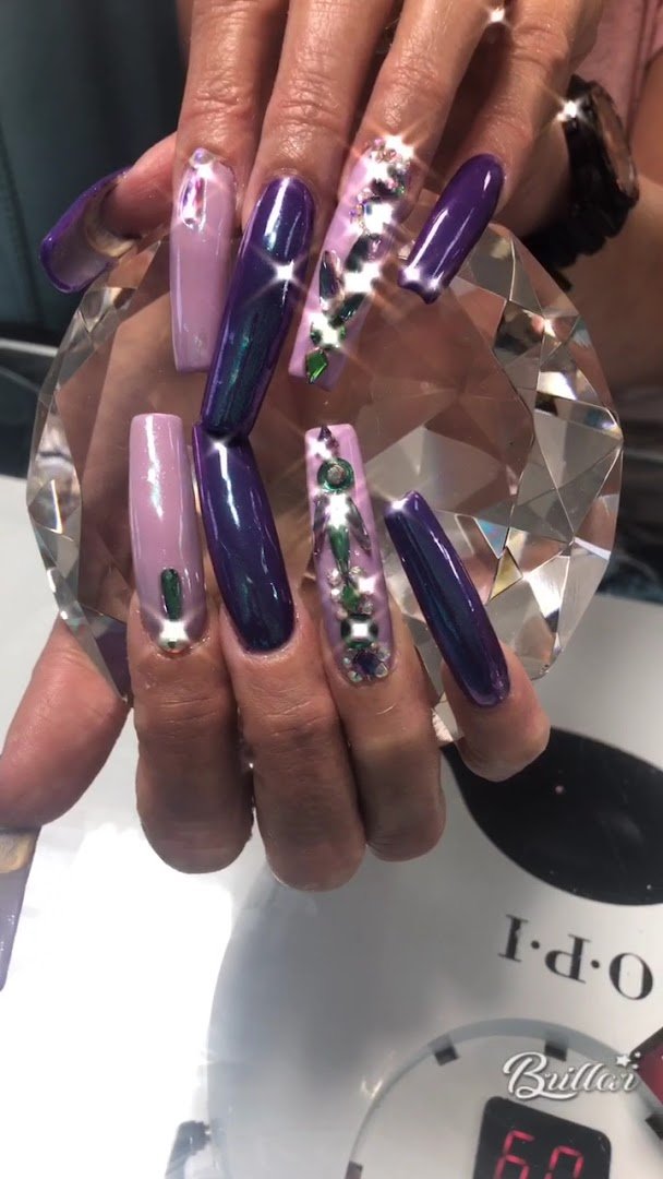 Close-up of painted nails and a soft hand massage.